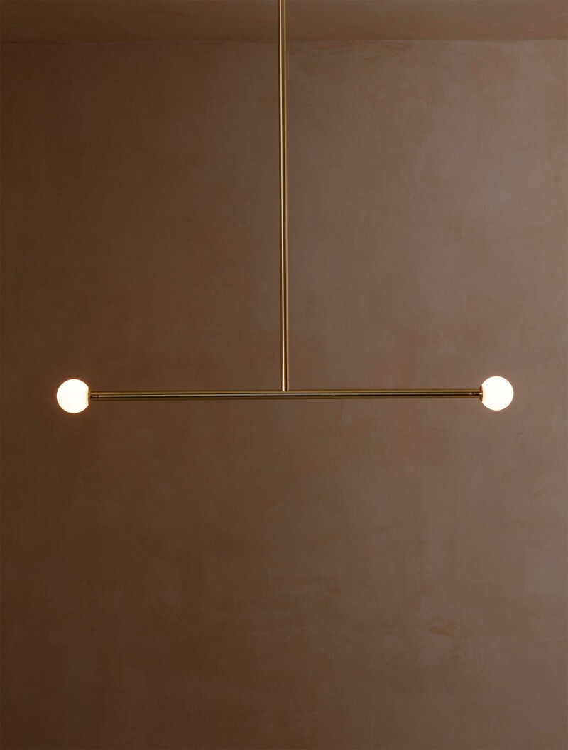 Brass T2 shown in Brass, Matte White Globes